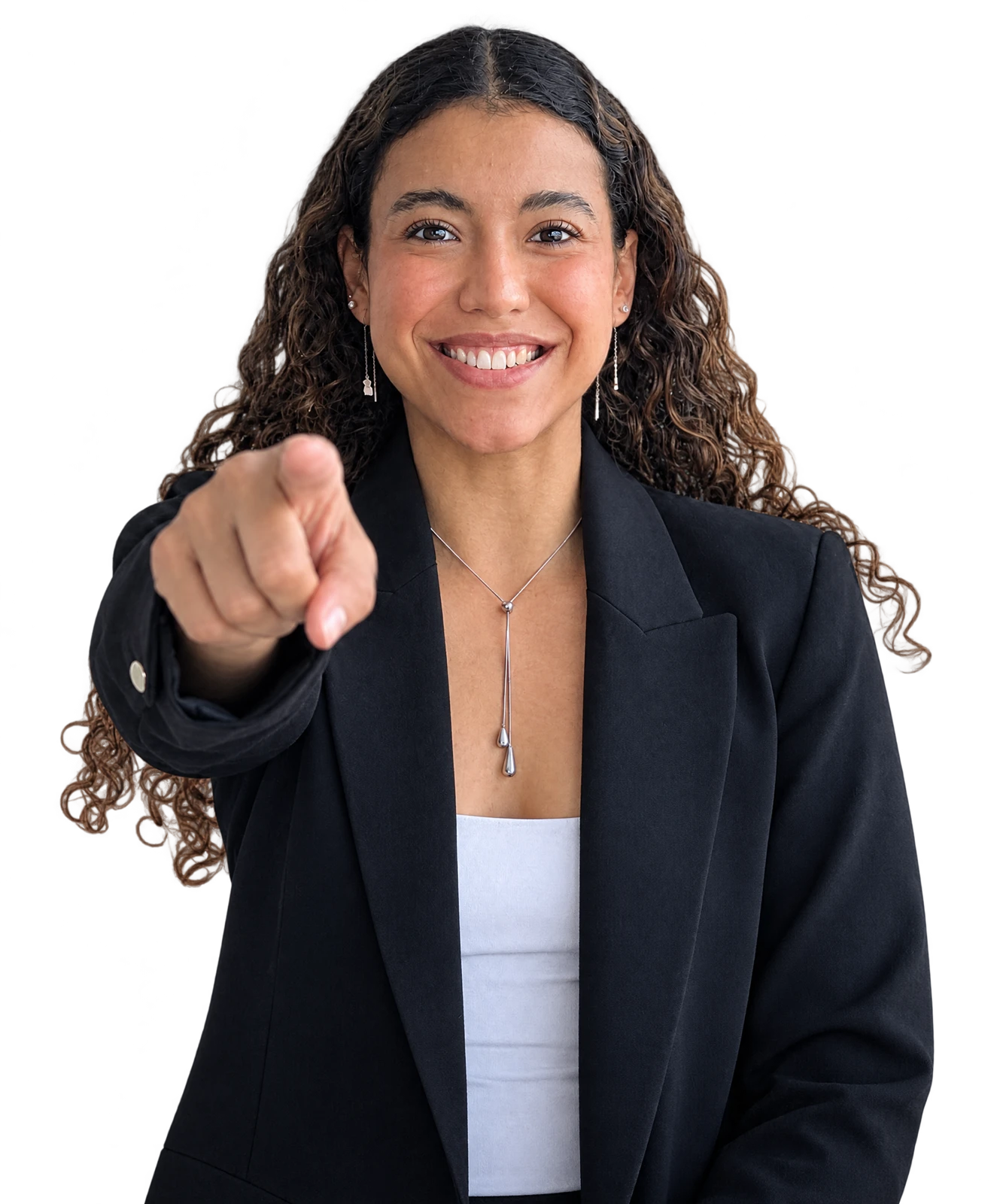 Paola Cano Gómez in a black blazer, smiling and pointing at the camera